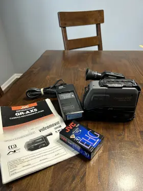 Gr-ax5compact Jvc Video Camera With Charger But No Battery. Not Tested