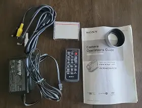 Dcr-hc65 Sony Accessory Lot Remote Lens Hood Ac Adaptor Av Cable Dvm60 Tape