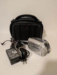 Canon Dc 100 Dvd Ntsc Camcorder Camera 25X Zoom 2.6 - 65MM 1:1.8 + Bag Works. Fixed Price $59.99.