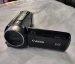 Canon Hf R50 Camcorder W/ Battery Charger Unsure If Works. Fixed Price $85.00.
