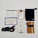 Flip Ultrahd Video Camera Orange White Built-in Memory One Hour Recording. Fixed Price $29.00.