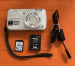 Nikon Coolpix S800C 16MP Digital Camera White Wifi W/32GB Sd & Charging Cable. Fixed Price $129.00.