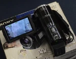 Sony HDR-PJ10 High Definition Handycam Camcorder Built-in Projector Lens Zoom. Fixed Price $179.99.