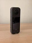 INSTA360 X5 Camera Black W/ Dual Fast Charge Case & Extendable Selfie Stick. Fixed Price $500.00.