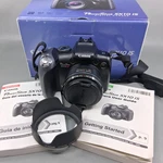 Canon Powershot SX10 Is 10MP Digital Camera 20X Zoom Lens Hood Box Tested Works. Fixed Price $70.00.