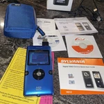 Sylvania HD1Z 720P Digital Video Camera Blue Screen Open Box. Fixed Price $19.99.