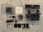 Gopro HERO4 Black Camera Bundle With Chest Harness, Battery, Mounts, Case. Fixed Price $45.00.