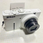 Nikon Coolpix P310 White Digital Camera 16.1MP 4.2X Zoom Full Hd 3.0IN Tft Lcd. Fixed Price $254.00.