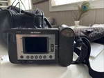 Sharp Model VL-E30U Liquid Crystal Camcorder And Accessories.. Fixed Price $30.50.